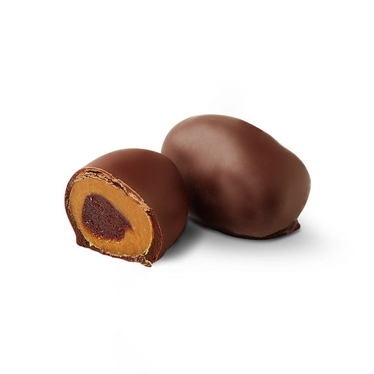 Guava chocoteja bonbon cut in half showing dulce de leche filling