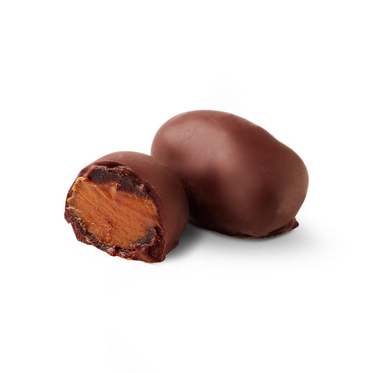 Prune chocoteja bonbon cut in half showing filling