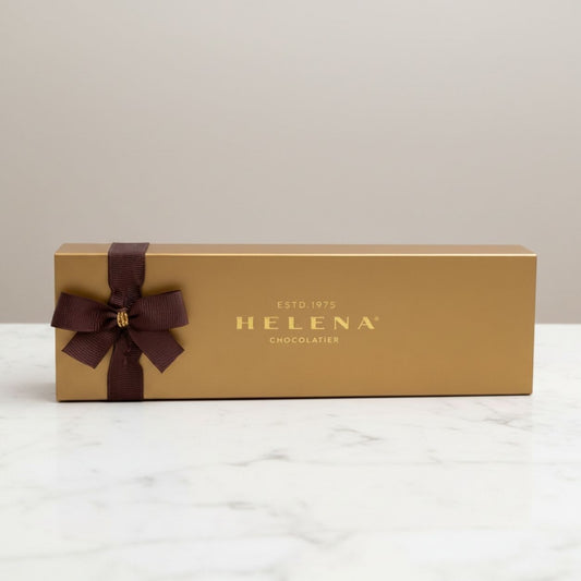Golden Chocoteja Bonbon 3-unit gift box by Helena Chocolatier on elegant background