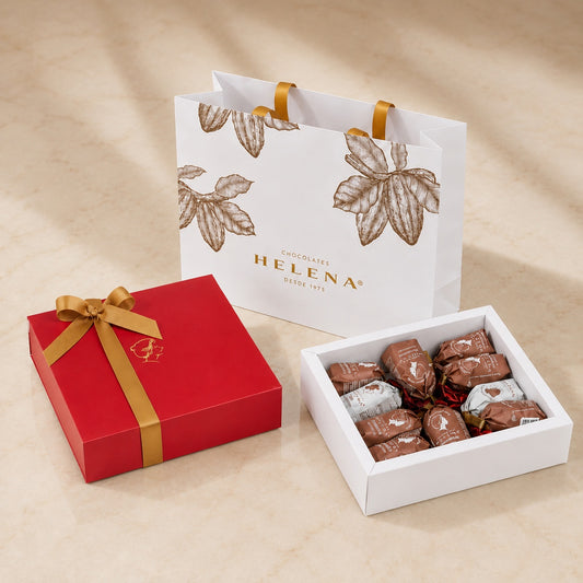 Assorted Helena Chocoteja Bonbons 10-unit red gift box with colorful wrappers on beige background.