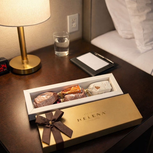 Helena Chocolatier Golden Chocoteja Bonbons presented in a hotel amenity setting