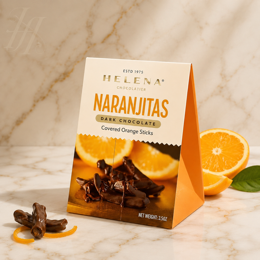 Helena Chocolatier Naranjitas – Dark chocolate covered orange sticks, 3.5 oz gift box on marble surface with fresh orange slices
