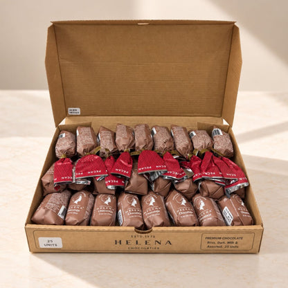 An open cardboard box of Helena Premium Chocolate Truffles, showing 25 individually wrapped chocolate truffles inside. The box is brown cardboard, and the chocolates are wrapped in brown chocolate coating with some featuring red paper bands.