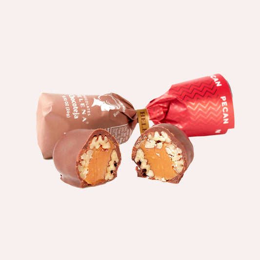 Award-winning Pecan Chocoteja Bonbon with smooth 45% Peruvian cacao chocolate coating and dulce de leche filling