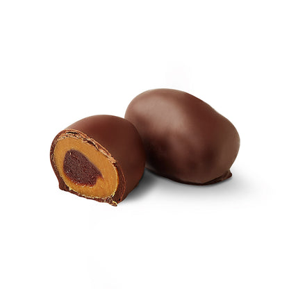 Guava chocoteja bonbon cut in half showing dulce de leche filling